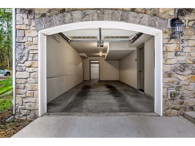 a view of a house with wooden fence