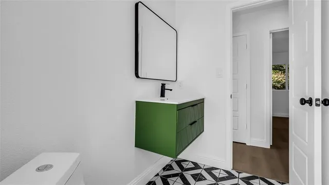 a bathroom with a sink and a mirror