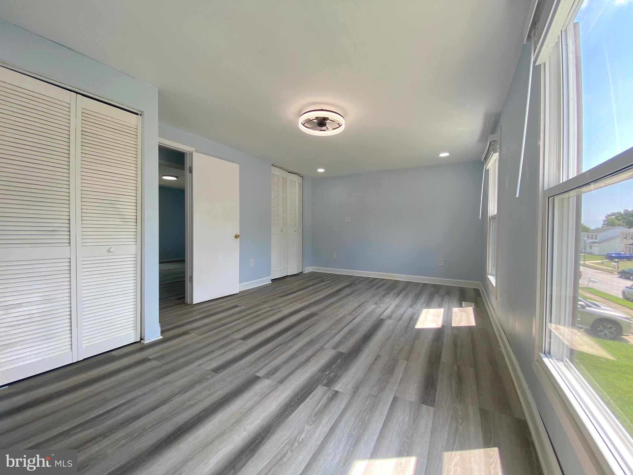 18 1st Light Court Rosedale, MD 21237 - Photo 12 of 29 a view of a room with wooden floor and a window