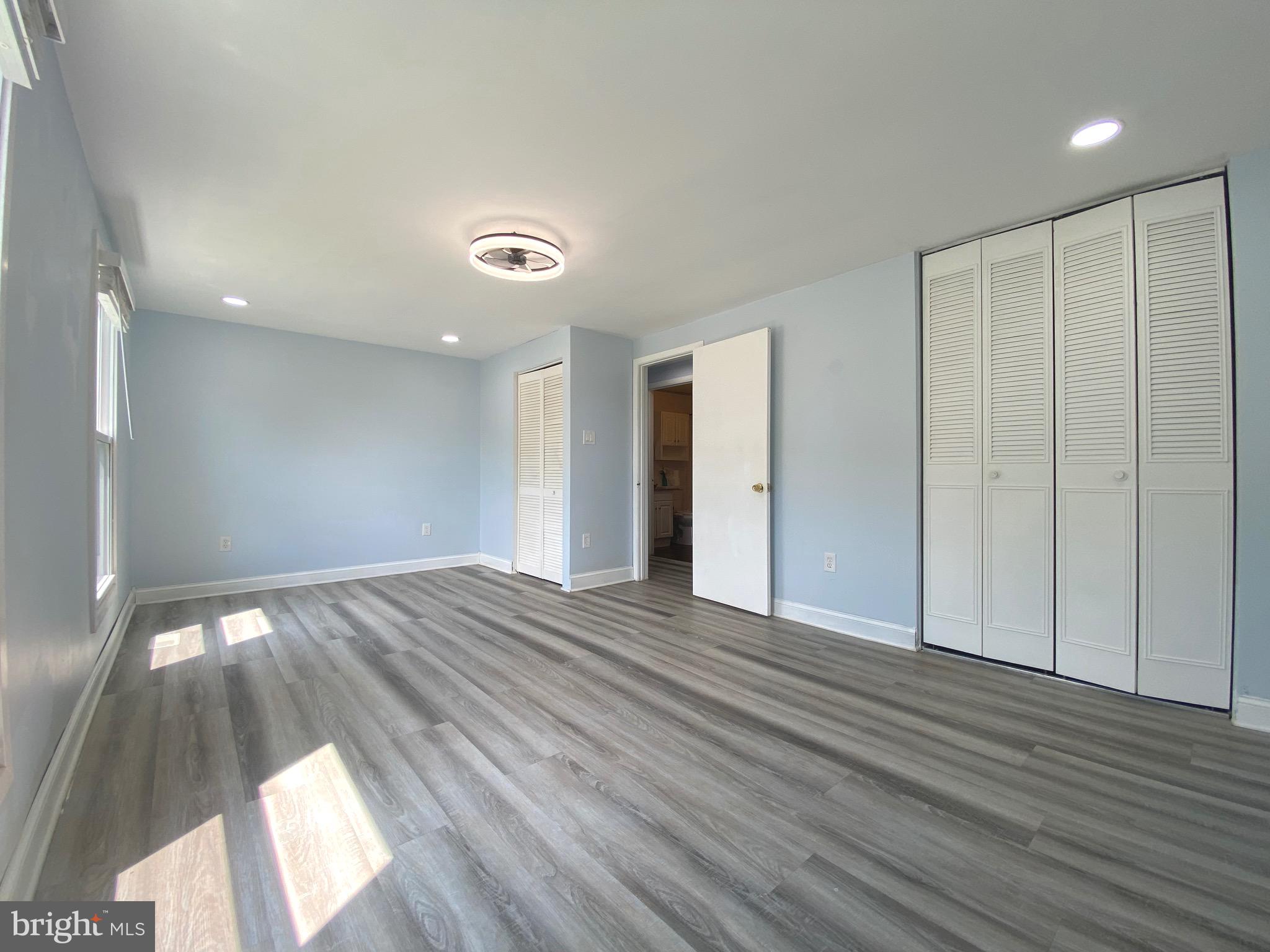 18 1st Light Court Rosedale, MD 21237 - Photo 14 of 29 a view of an empty room and wooden floor