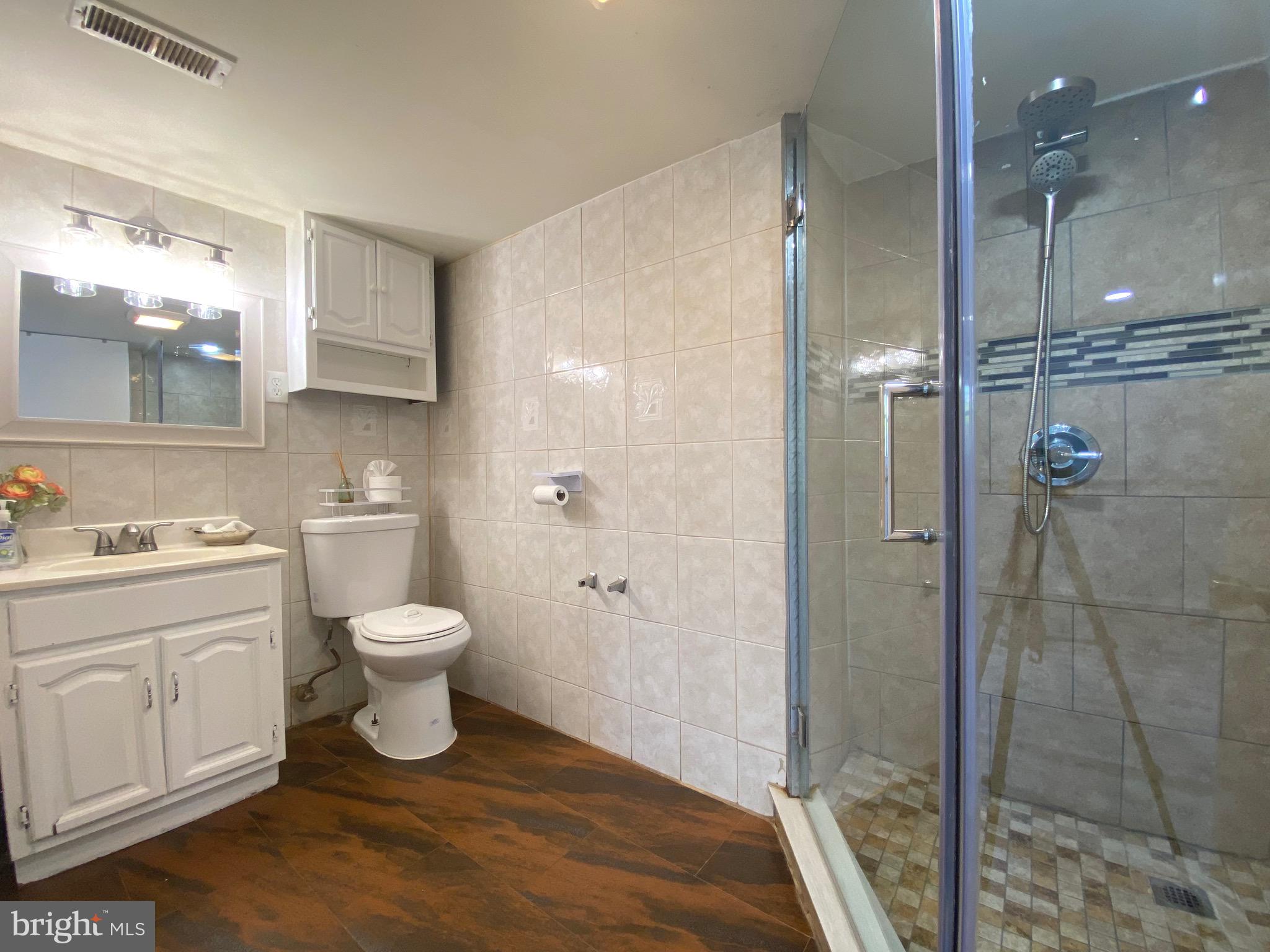 18 1st Light Court Rosedale, MD 21237 - Photo 18 of 29 a bathroom with a sink toilet and shower