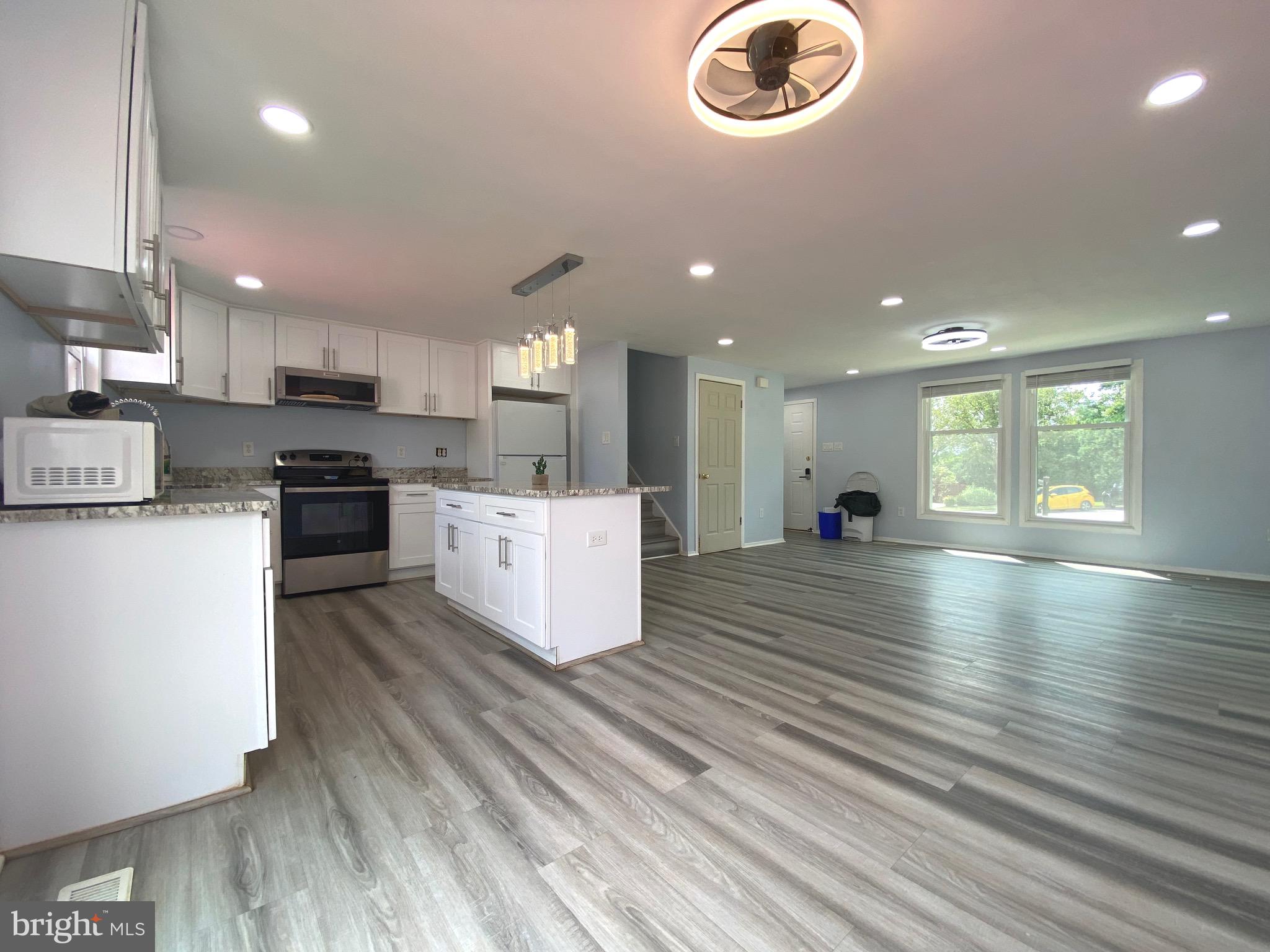 18 1st Light Court Rosedale, MD 21237 - Photo 2 of 29 a view of kitchen with cabinets and wooden floor