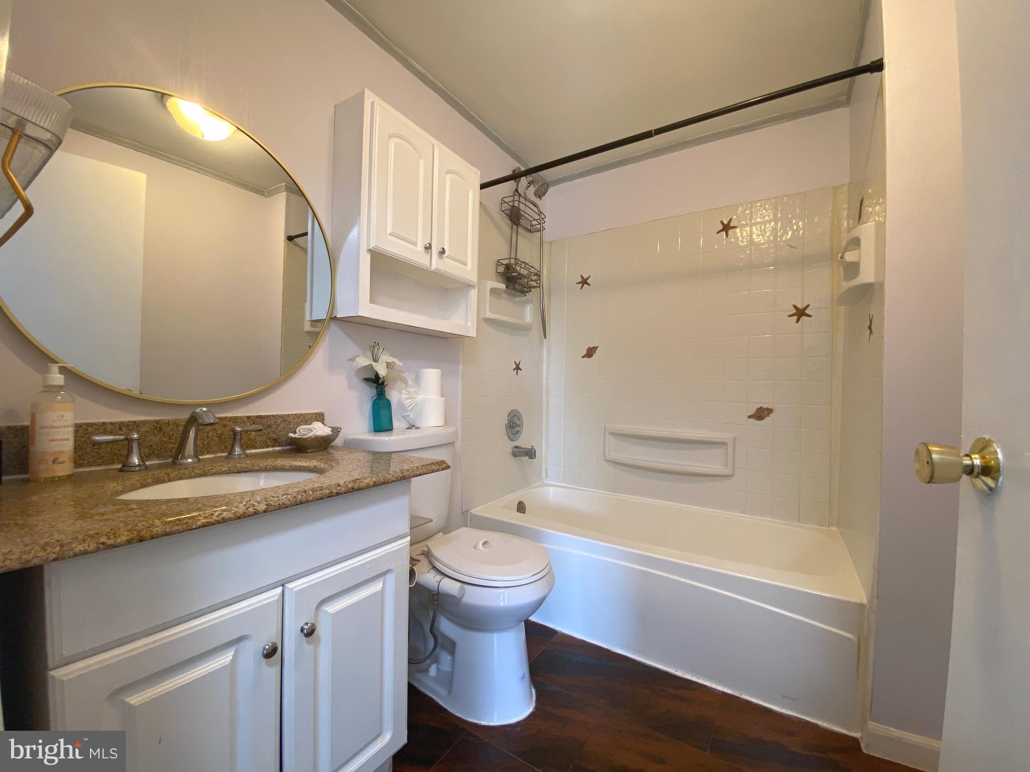 18 1st Light Court Rosedale, MD 21237 - Photo 8 of 29 a bathroom with a granite countertop sink toilet and shower