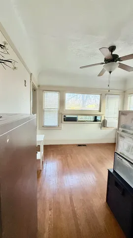 a view of a kitchen with a sink and a stove top oven