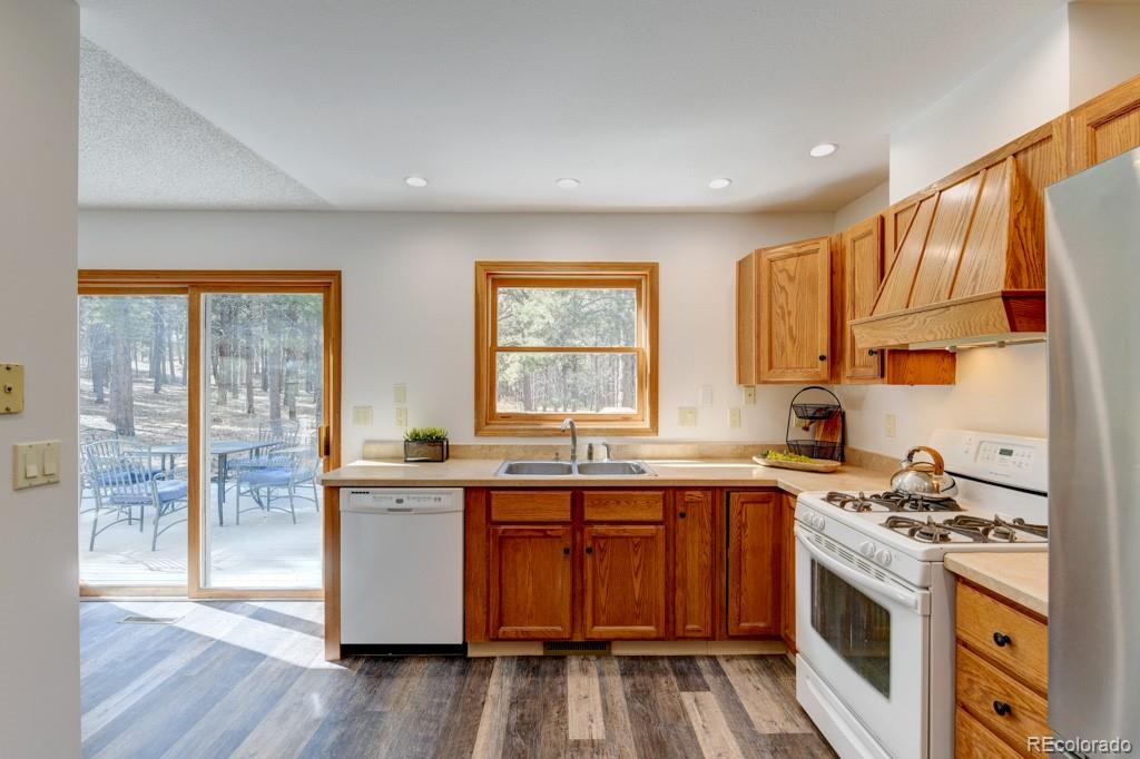 18673 North Elbert Road Elbert, CO 80106 - Photo 18 of 50 a kitchen with stainless steel appliances a stove a sink and a refrigerator