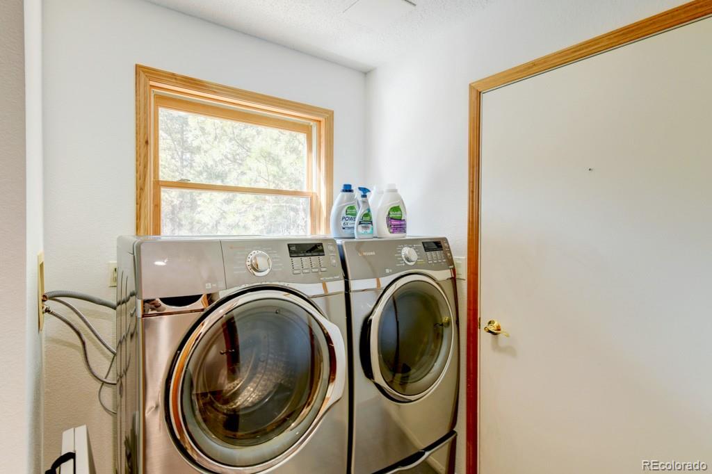 18673 North Elbert Road Elbert, CO 80106 - Photo 19 of 50 a utility room with dryer and washer