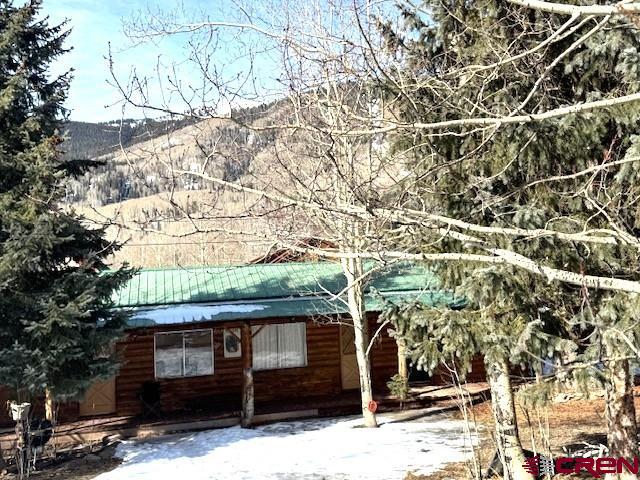 15 South Silver Street Rico, CO 81332 - Photo 2 of 15 a front view of a house with a tree