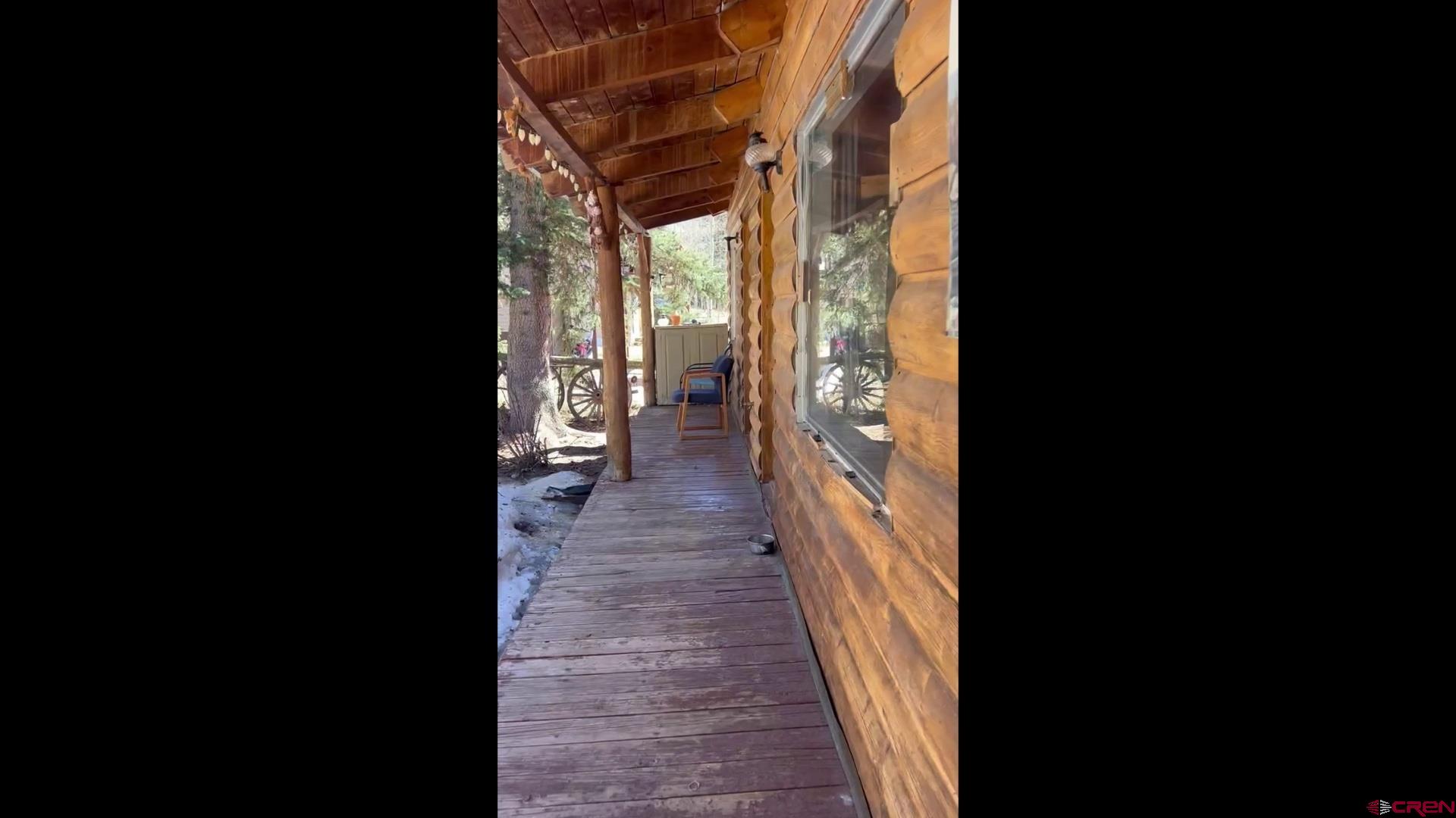 15 South Silver Street Rico, CO 81332 - Photo 3 of 15 a view of a porch with wooden floor and a yard