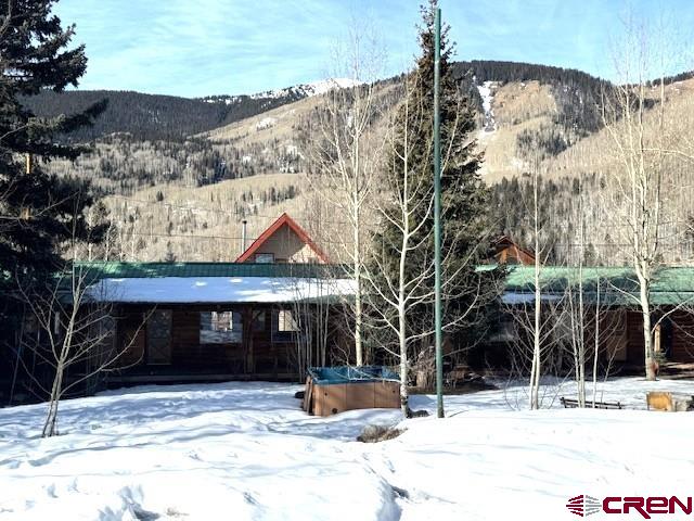 15 South Silver Street Rico, CO 81332 - Photo 9 of 15 a view of a house with snow on the road