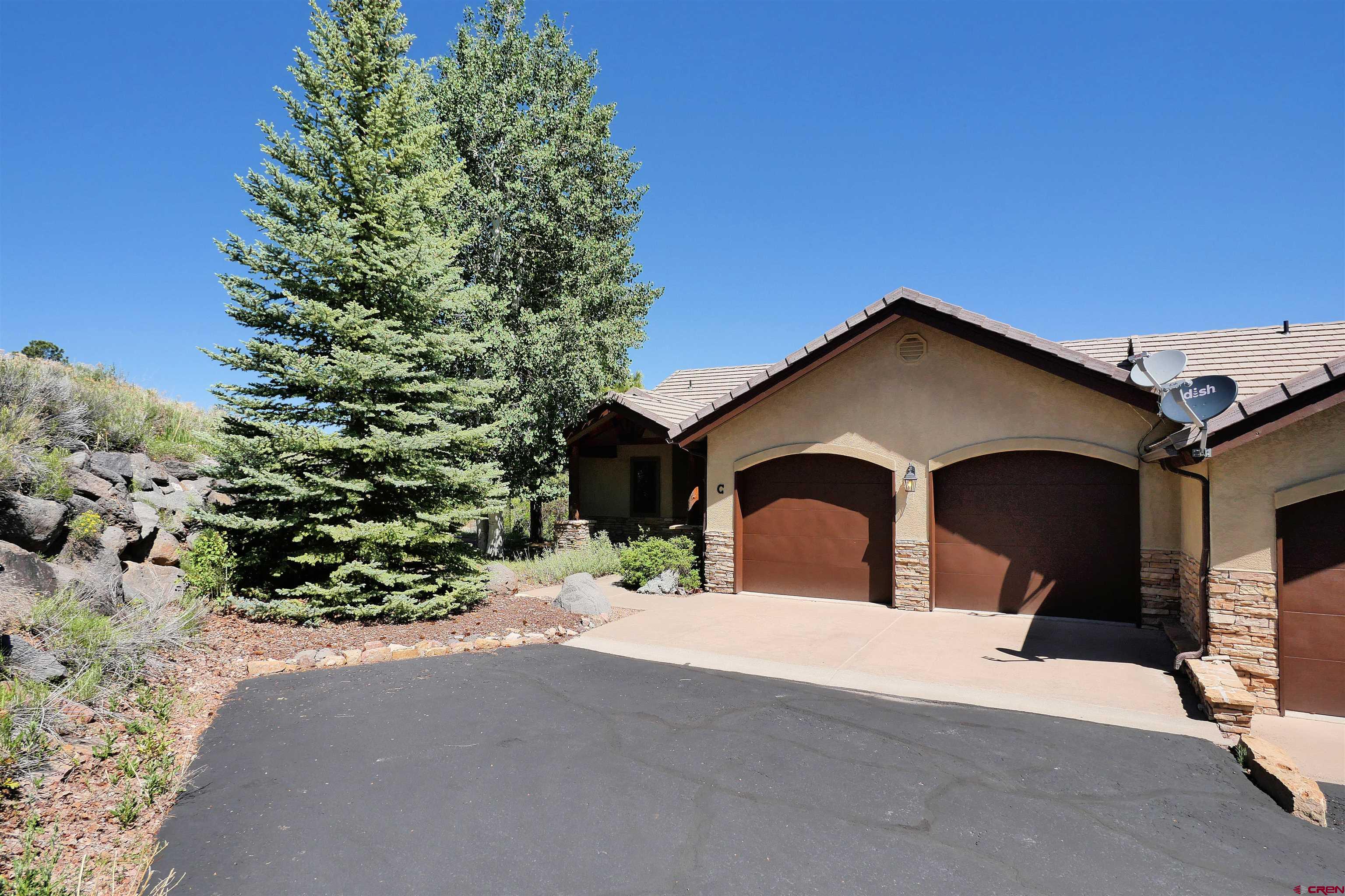 201 Woodchuck Place Ridgway, CO 81432 - Photo 7 of 33 a view of a house with a yard