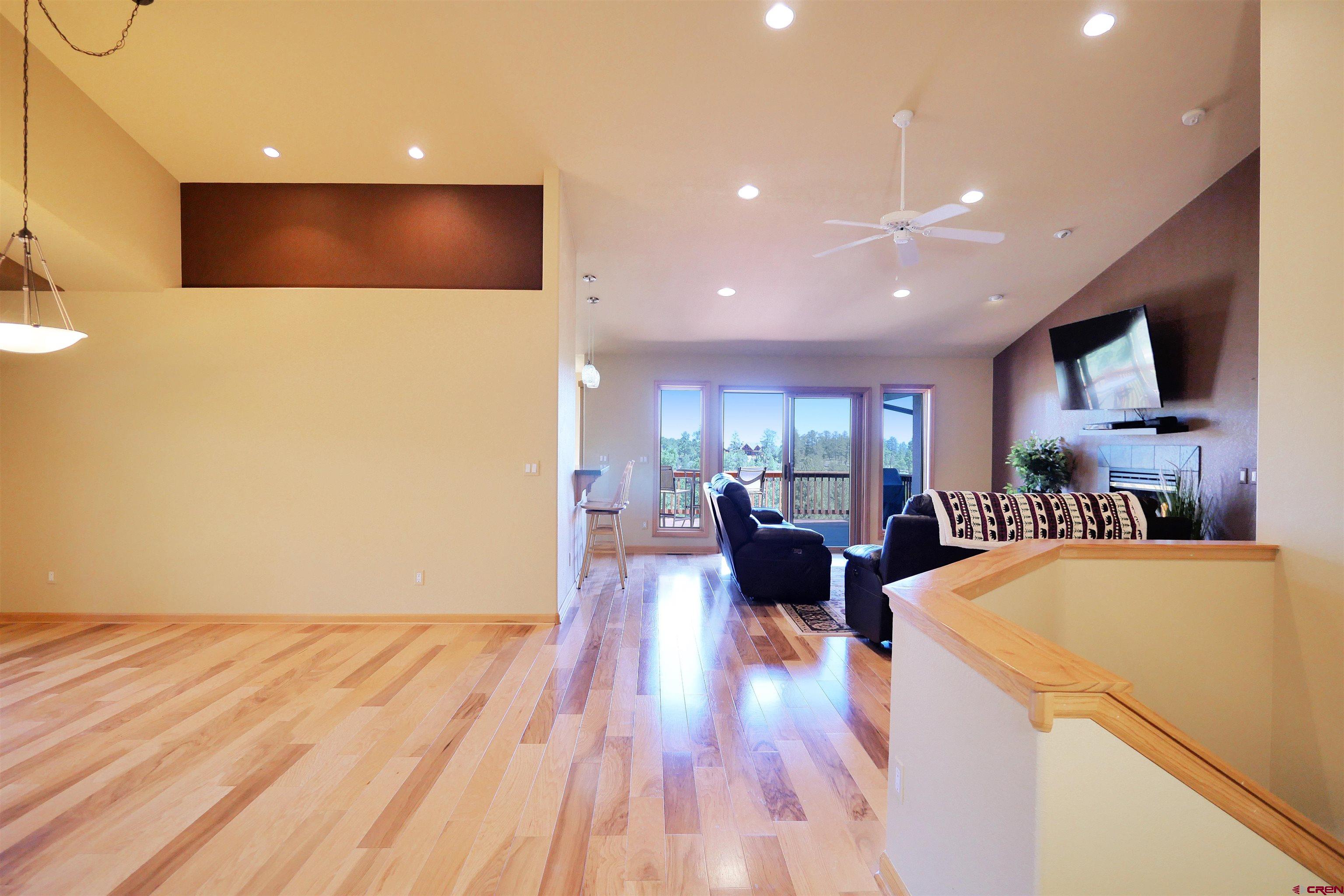 201 Woodchuck Place Ridgway, CO 81432 - Photo 10 of 33 a living room with couches and a flat screen tv