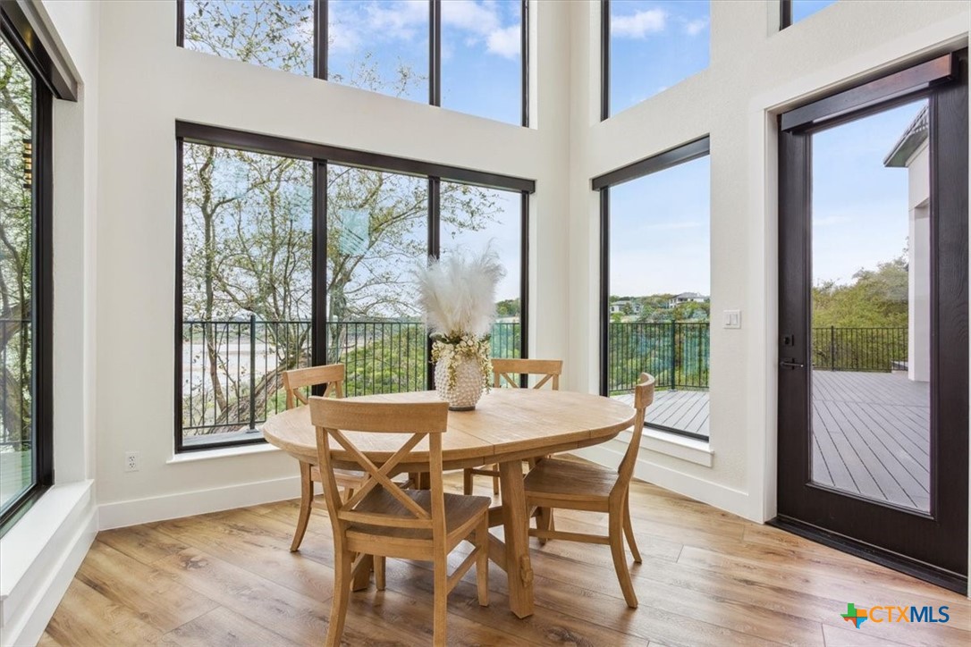 4802 Elf Trail Belton, TX 76513 - Photo 11 of 48 a dining room with furniture window and wooden floor