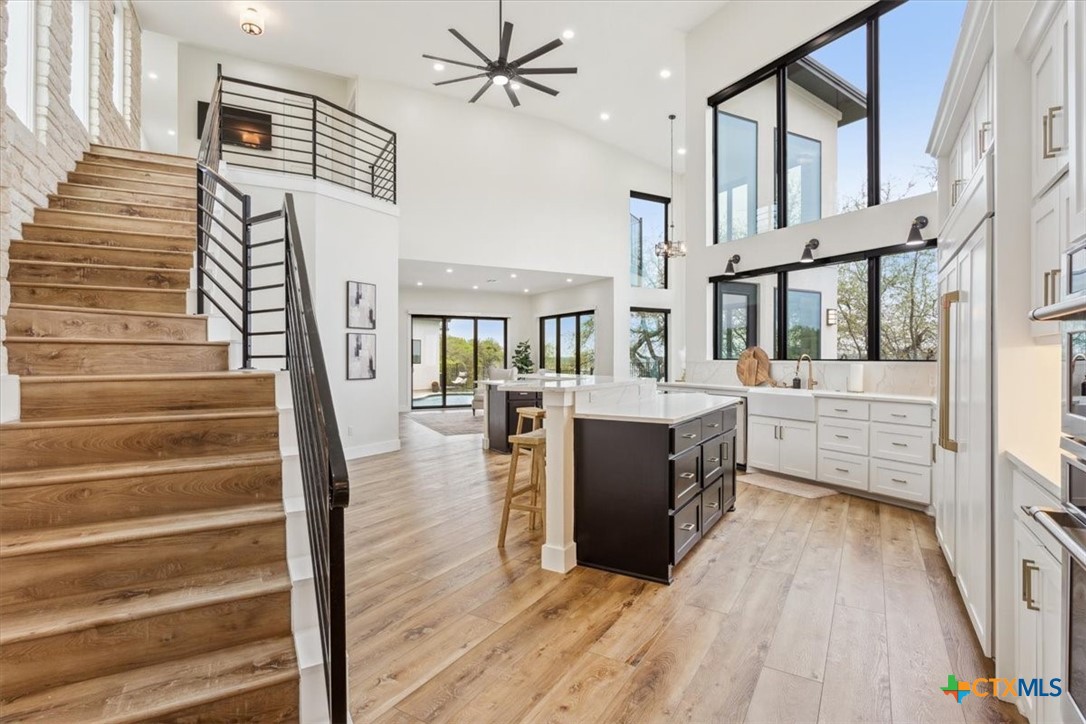 4802 Elf Trail Belton, TX 76513 - Photo 17 of 48 a view of a kitchen center island and staircase