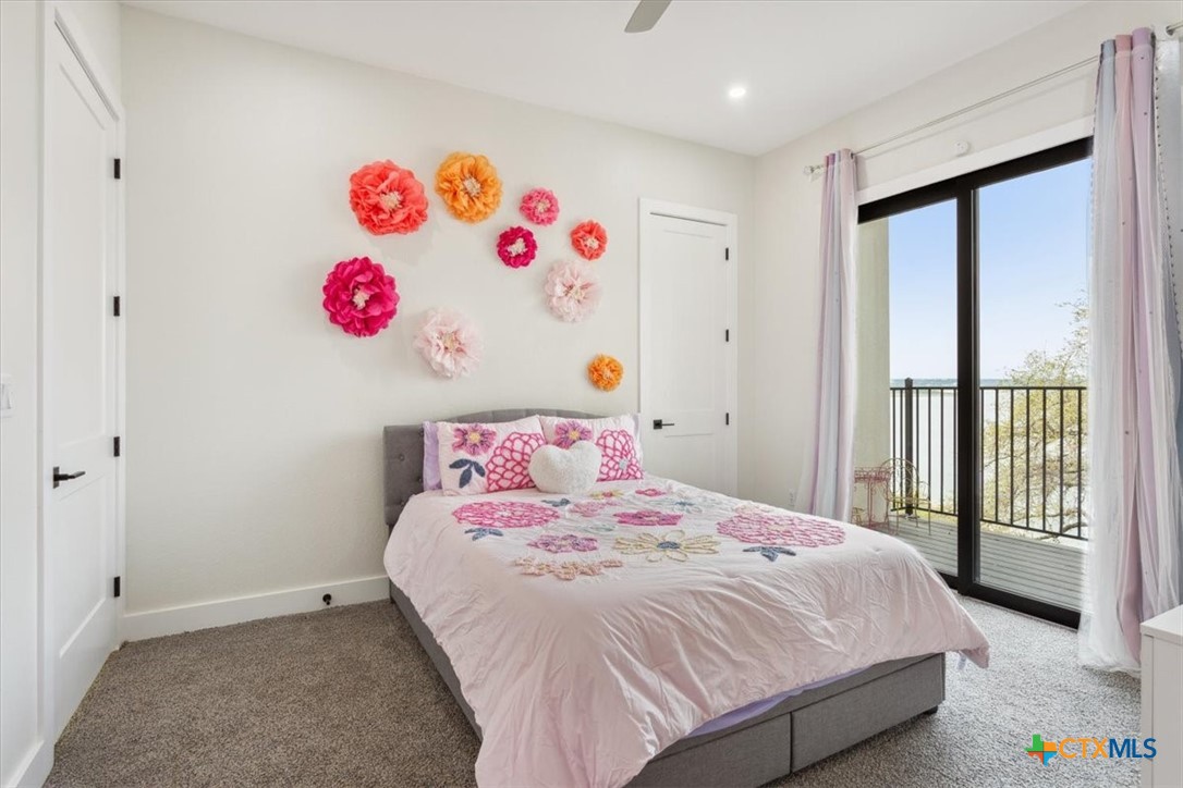 4802 Elf Trail Belton, TX 76513 - Photo 27 of 48 a bedroom with a bed and a large mirror