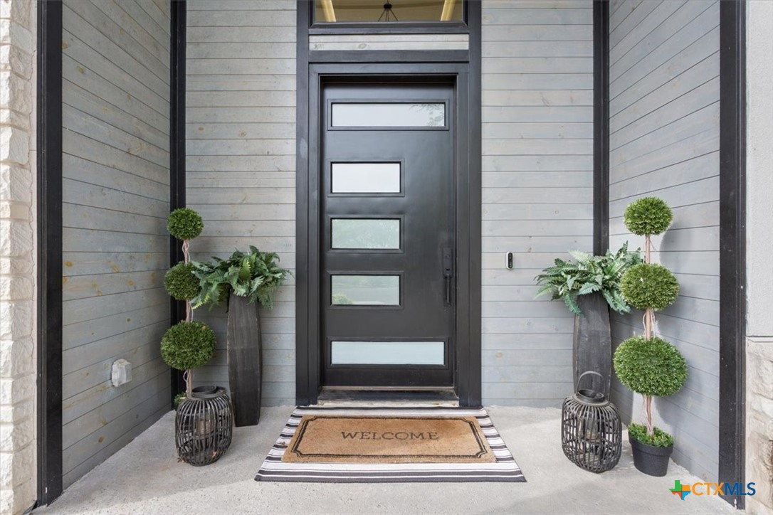 4802 Elf Trail Belton, TX 76513 - Photo 3 of 48 a potted plant sitting on the side of a brick building