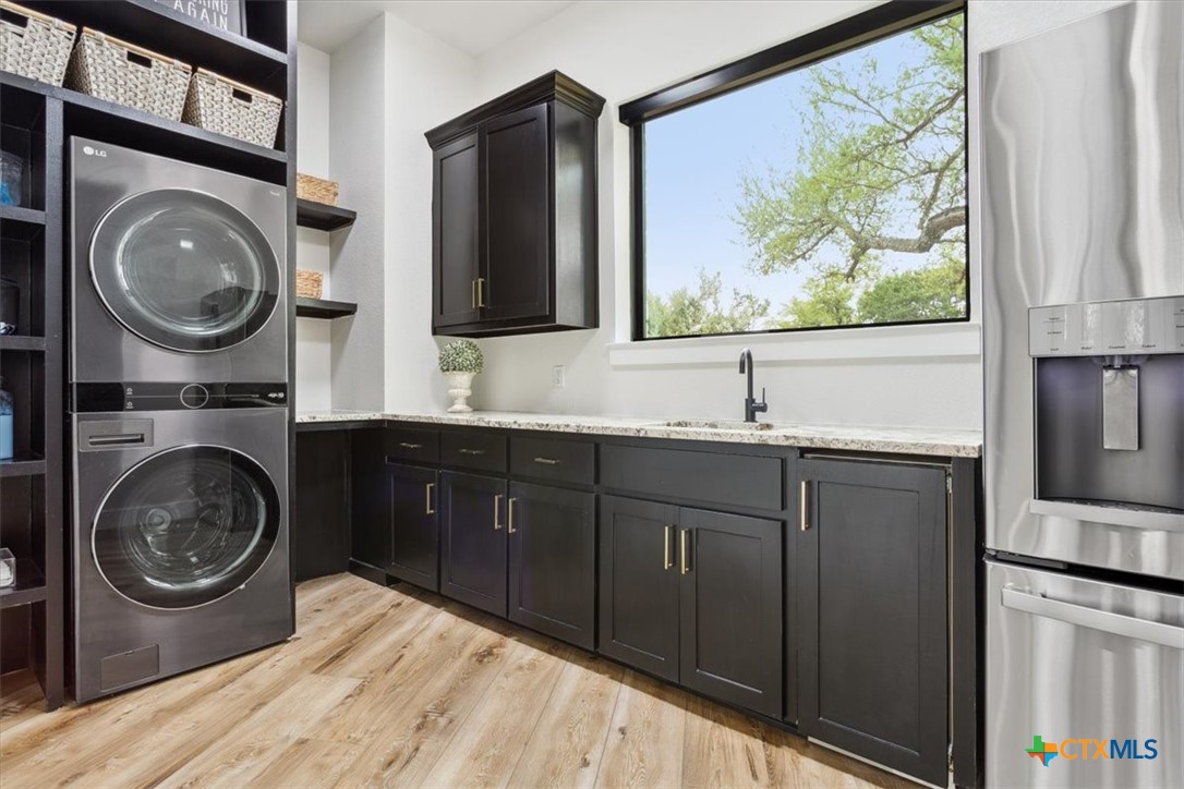 4802 Elf Trail Belton, TX 76513 - Photo 33 of 48 a kitchen with a refrigerator and a sink