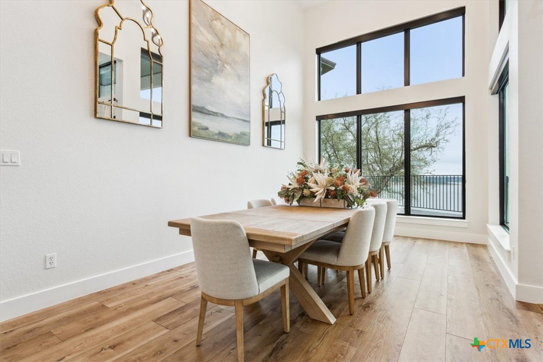 4802 Elf Trail Belton, TX 76513 - Photo 6 of 48 a view of a dining room with furniture window and wooden floor