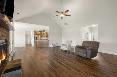a kitchen with granite countertop stainless steel appliances and wooden cabinets