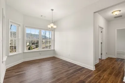 a kitchen with stainless steel appliances granite countertop a sink stove and microwave