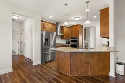 a view of a house with wooden floor and iron stairs