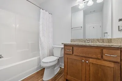 a view of an empty room with a bathroom