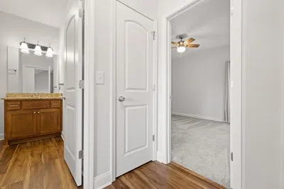 a view of a room with wooden floor
