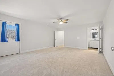 a building outdoor space with patio furniture and potted plants