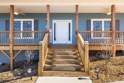 a view of a balcony with wooden floor