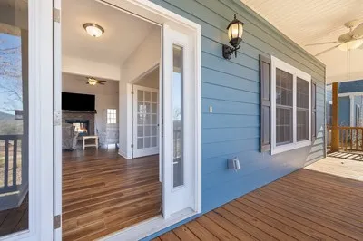a living room with furniture fireplace and flat screen tv