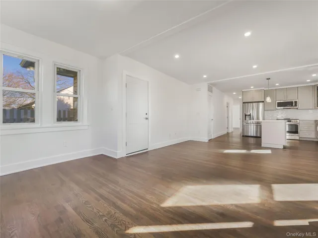 a view of a kitchen with a sink cabinets and a window