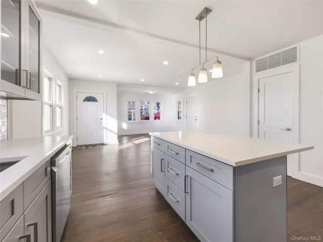 a bathroom with a sink double vanity granite and a mirror