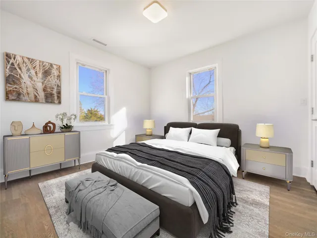 a spacious bedroom with a bed and a couch