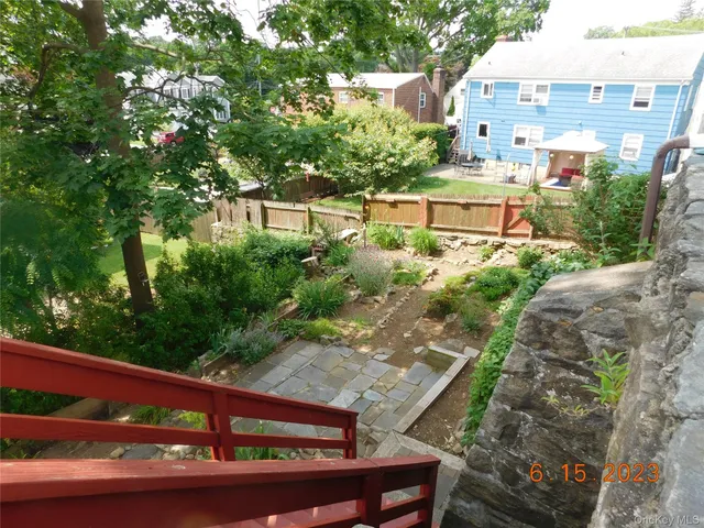 a view of a bench in a back yard