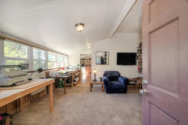 a kitchen with granite countertop a refrigerator and a sink