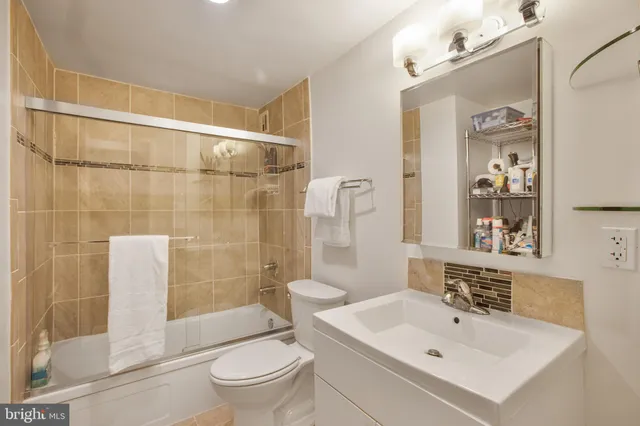 a kitchen with a sink and refrigerator