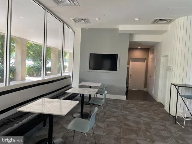 a view of a chairs and tables in patio