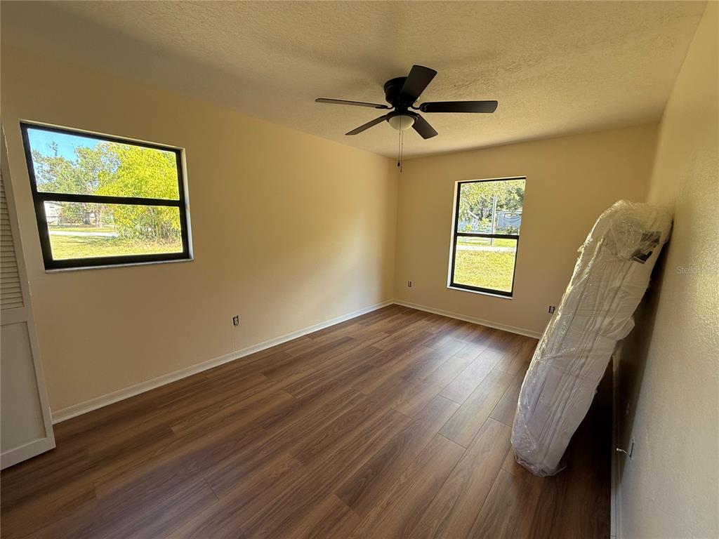 2211 Englewood Road Englewood, FL 34223 - Photo 53 of 86 a view of a hallway with a window