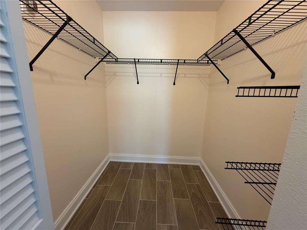 2211 Englewood Road Englewood, FL 34223 - Photo 54 of 86 a view of a room with racks on the wall