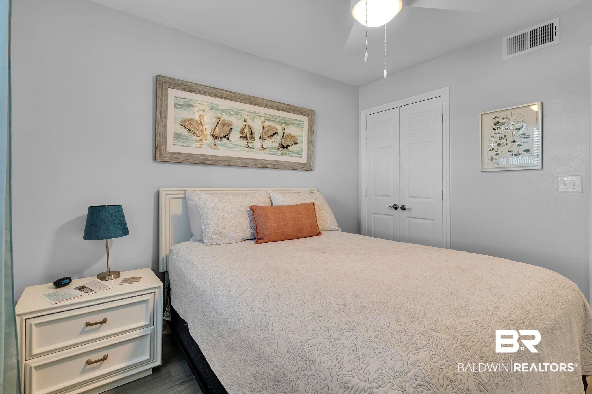 400 Plantation Road, Unit 4115 Gulf Shores, AL 36542 - Photo 17 of 48 Bedroom featuring ceiling fan, dark wood-type flooring, and a closet