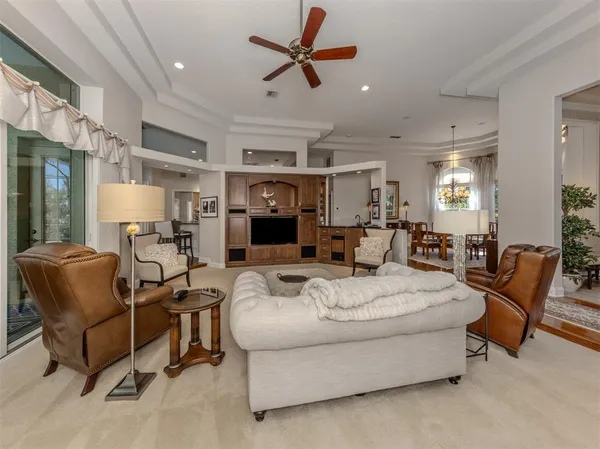 a kitchen with kitchen island granite countertop a sink a counter top space cabinets and stainless steel appliances