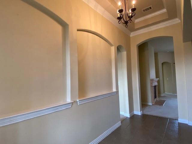 4952 Stephanie Street Frisco, TX 75033 - Photo 2 of 21 a view of a hallway with a chandelier fan
