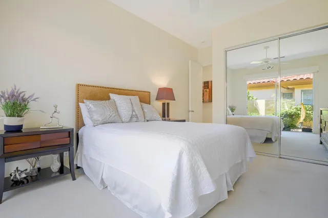 a bedroom with bed and a window