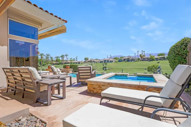 a view of a terrace with sitting area