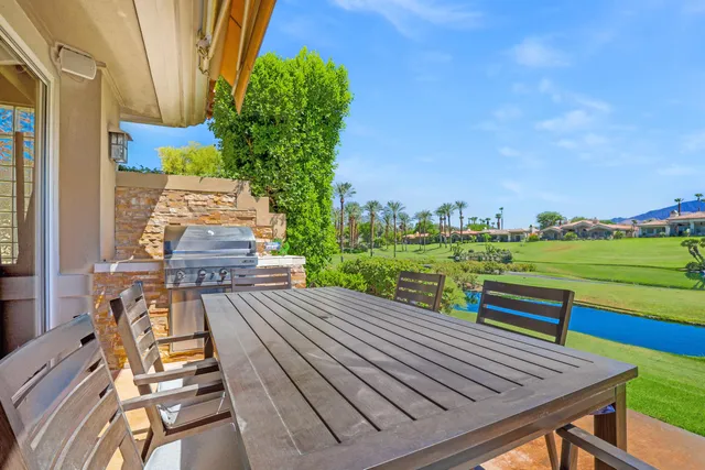 a view of a wooden deck with chairs