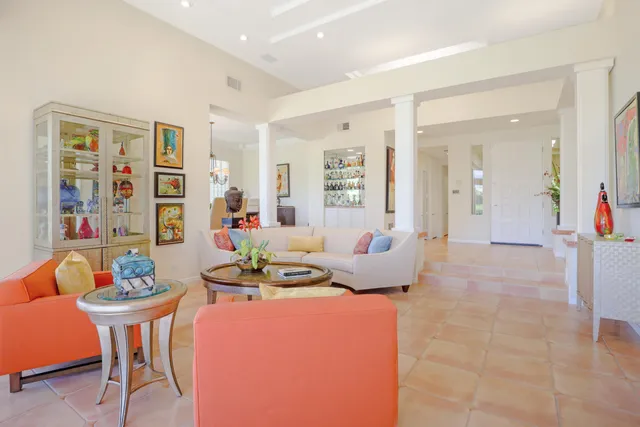 a living room with furniture and a table