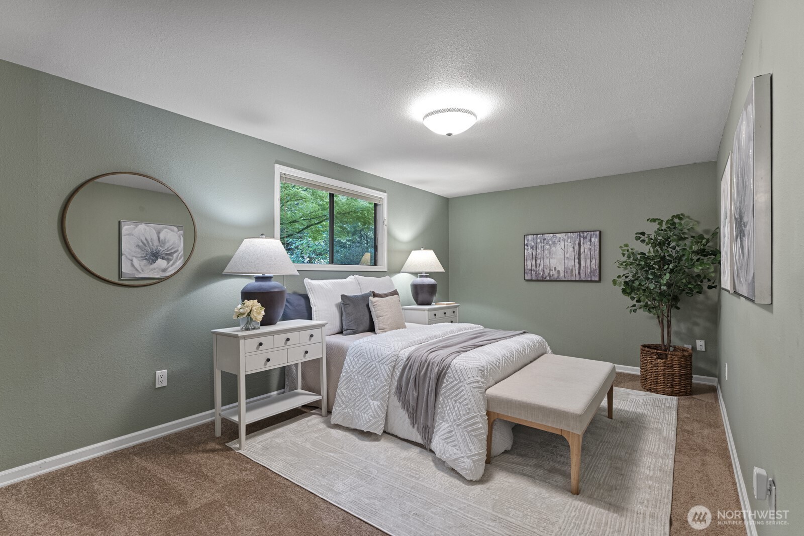 7727 Lake Alice Road Southeast Fall City, WA 98024 - Photo 11 of 34 a bedroom with bed furniture and a potted plant