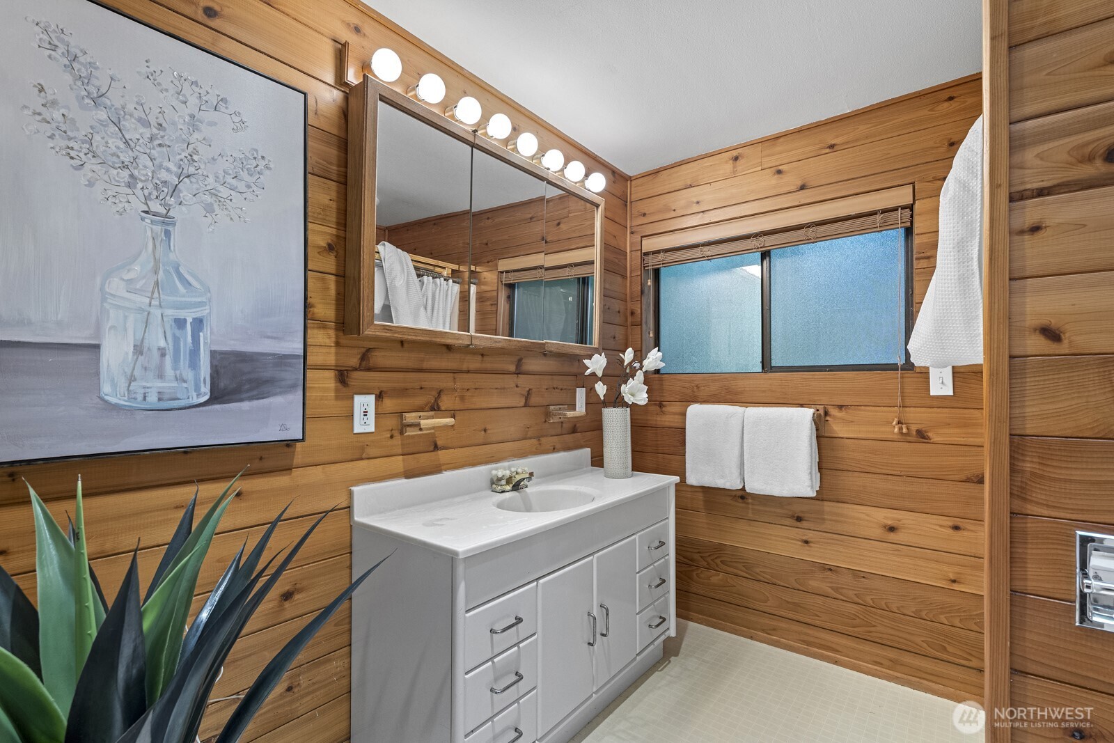 7727 Lake Alice Road Southeast Fall City, WA 98024 - Photo 13 of 34 a bathroom with a sink and a mirror