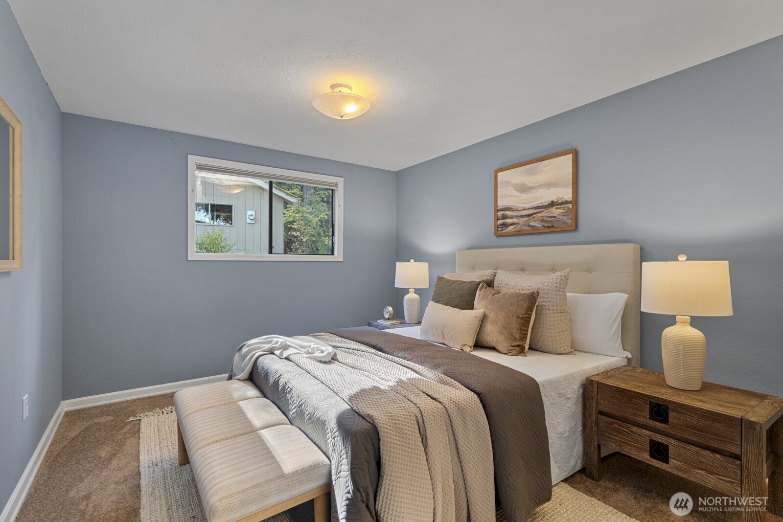 7727 Lake Alice Road Southeast Fall City, WA 98024 - Photo 15 of 34 a bedroom with bed and a window