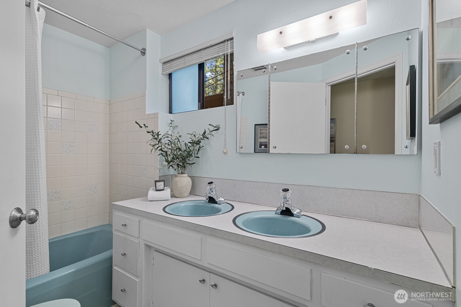 7727 Lake Alice Road Southeast Fall City, WA 98024 - Photo 17 of 34 a bathroom with a sink and a mirror