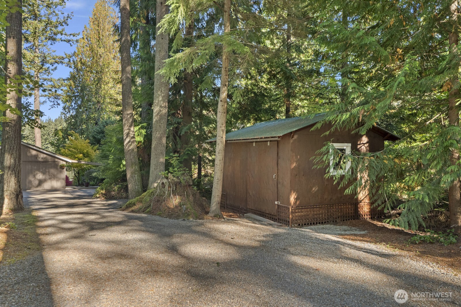 7727 Lake Alice Road Southeast Fall City, WA 98024 - Photo 20 of 34 a view of a house with backyard and trees
